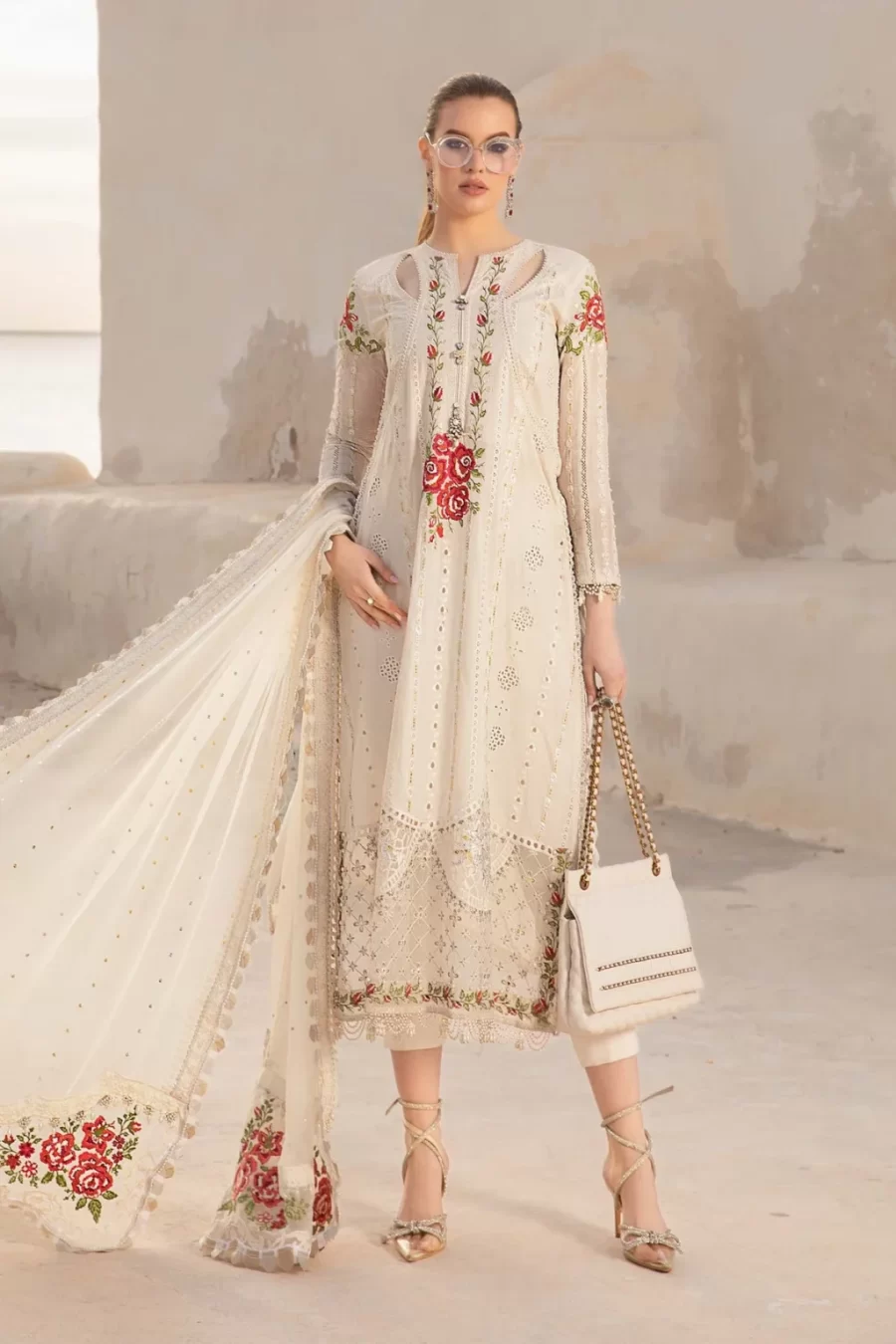 Shop Unstitched Pakistani suits featuring embroidered lawn sleeves, organza ghera patch, and dupatta patti with free shipping & cash on delivery at Fabcollections.