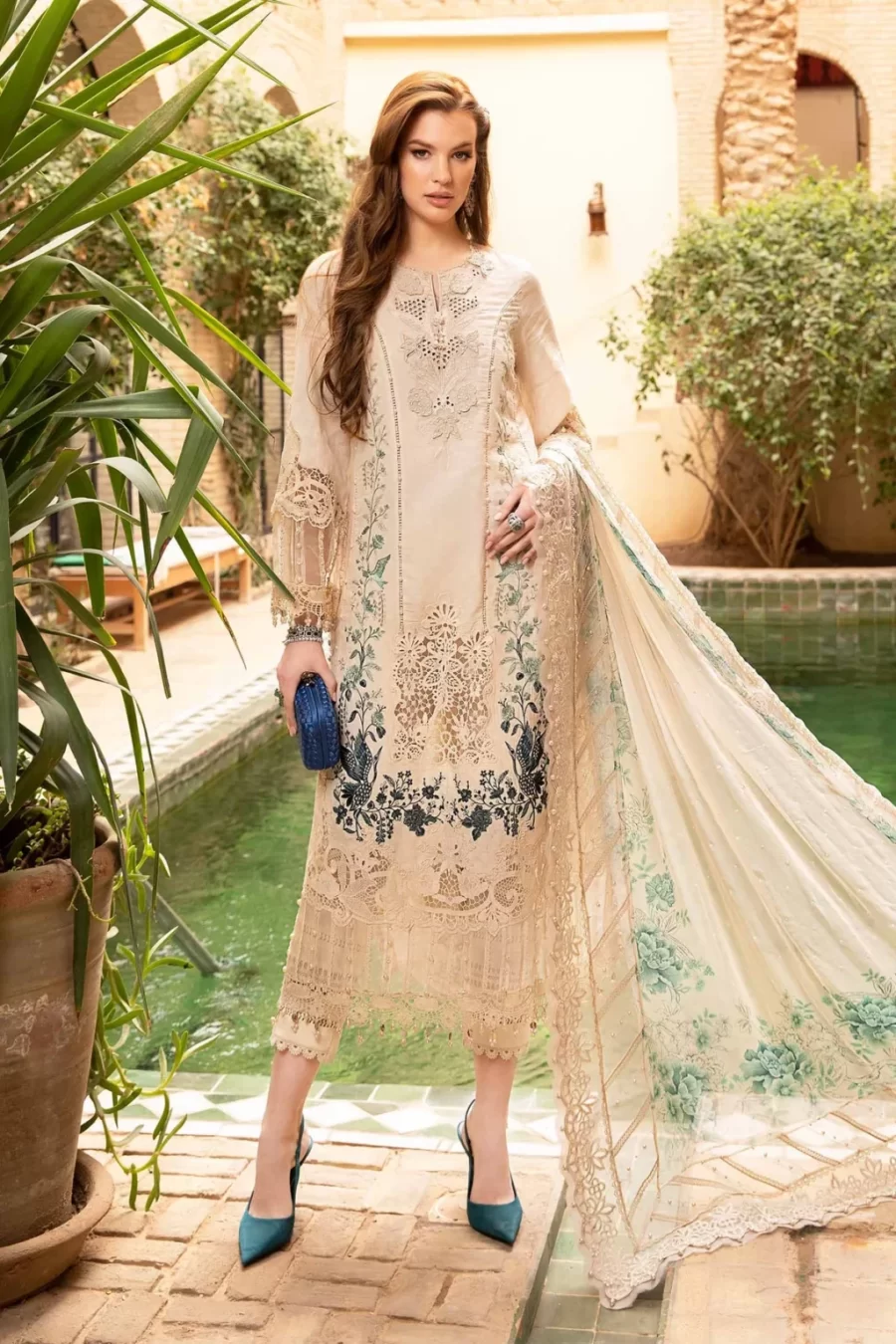 Discover elegant Pakistani suits online at Fabcollections with intricate organza neck patches and ghera patti. Free shipping and cash on delivery.