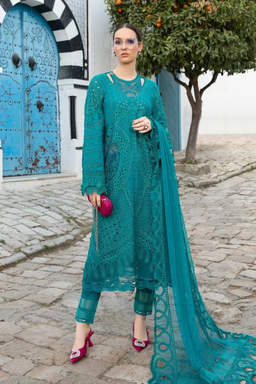 Discover elegant unstitched lawn suits at Fabcollections with embroidered neck patch and organza ghera patch. Free shipping and cash on delivery.