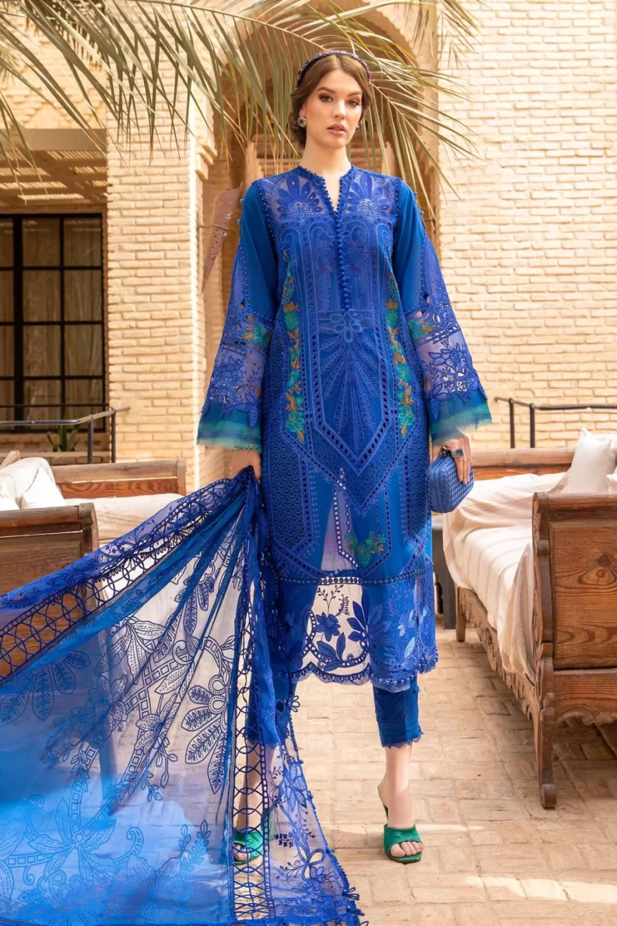 Shop stylish Lahore suits online at Fabcollections featuring intricate embroidered side panels and sleeves patti. Free shipping and cash on delivery.