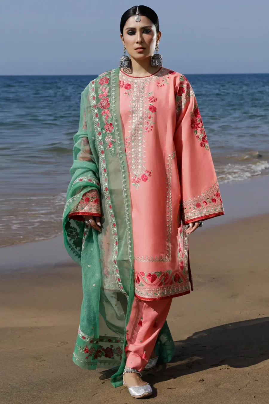 Discover our unstitched lawn suits featuring a stunning staple lawn kurta with floral embroidered dupatta, inspired by Central Asian tunics.