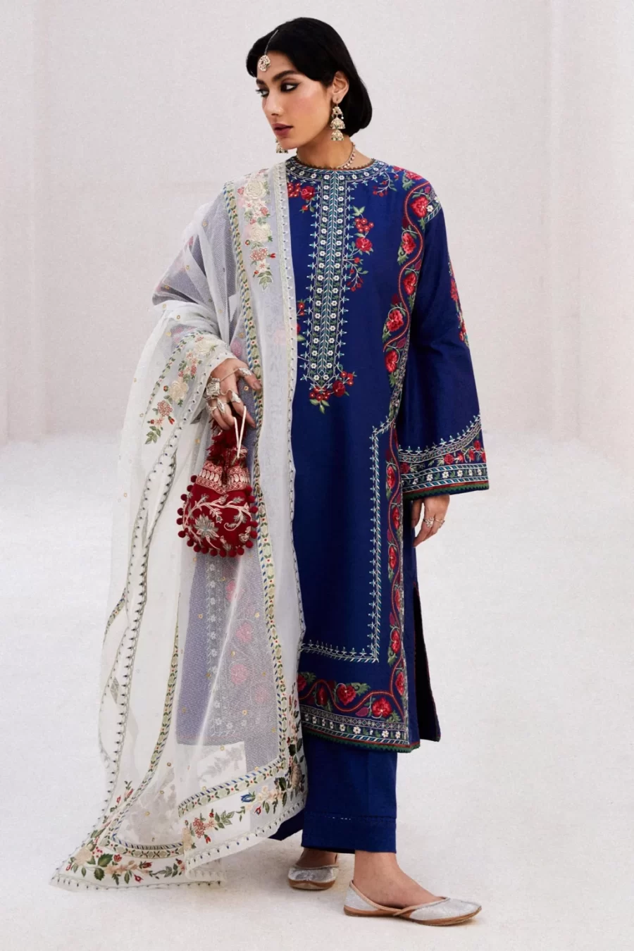 Discover stylish Pakistani suits online featuring a staple lawn kurta with floral embroidered dupatta. Perfect for summer elegance.