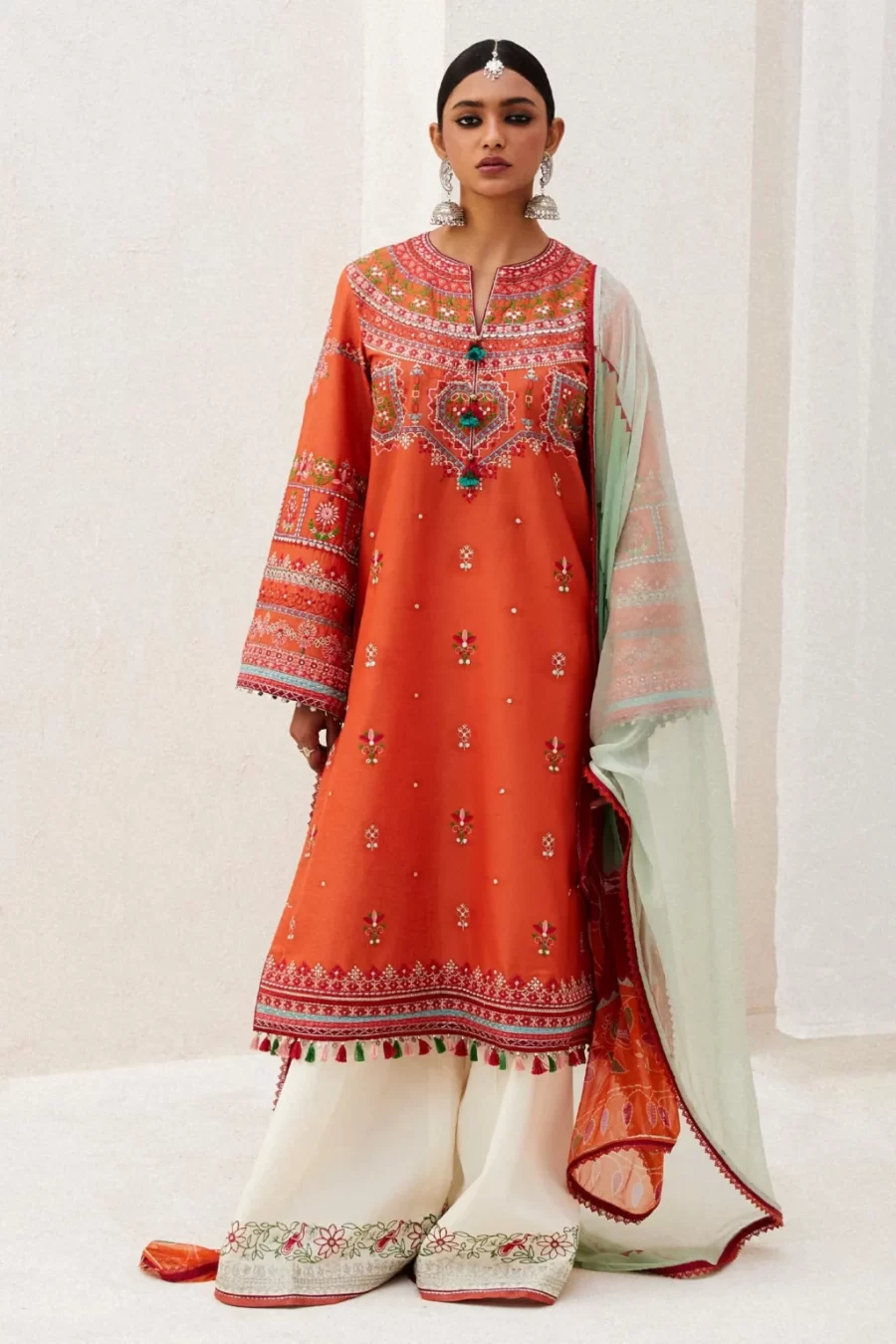 Explore lawn suits online: Lamia unstitched dress material with Central Asian embroidery, chiffon dupatta, and organza borders.