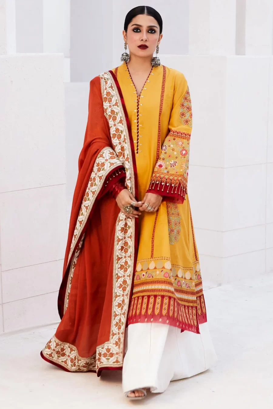 Explore the Sandal kurta with jacquard base and chiffon dupatta, perfect for Lahore suits online at Fabcollections.