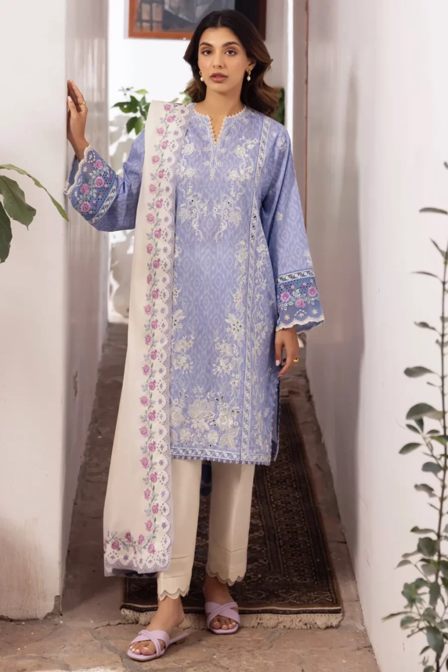 Step out in style with printed lawn suits, complete with embroidered sleeves border, organza hem borders, and voile dupatta for a chic look.