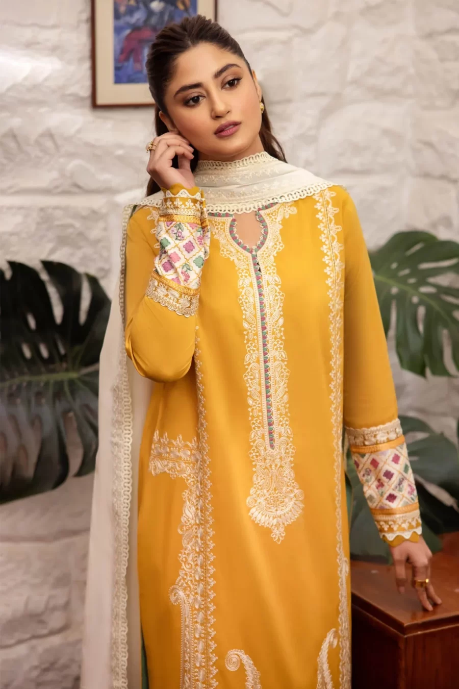 Explore modern Karachi Pakistani suits online at Fabcollections featuring satin sleeve borders, embroidered lawn panels, and voile center duppata.