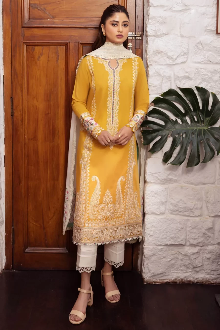 Elevate your wardrobe with Karachi Pakistani suits featuring dyed lawn back, cambric trouser, and satin sleeve borders.