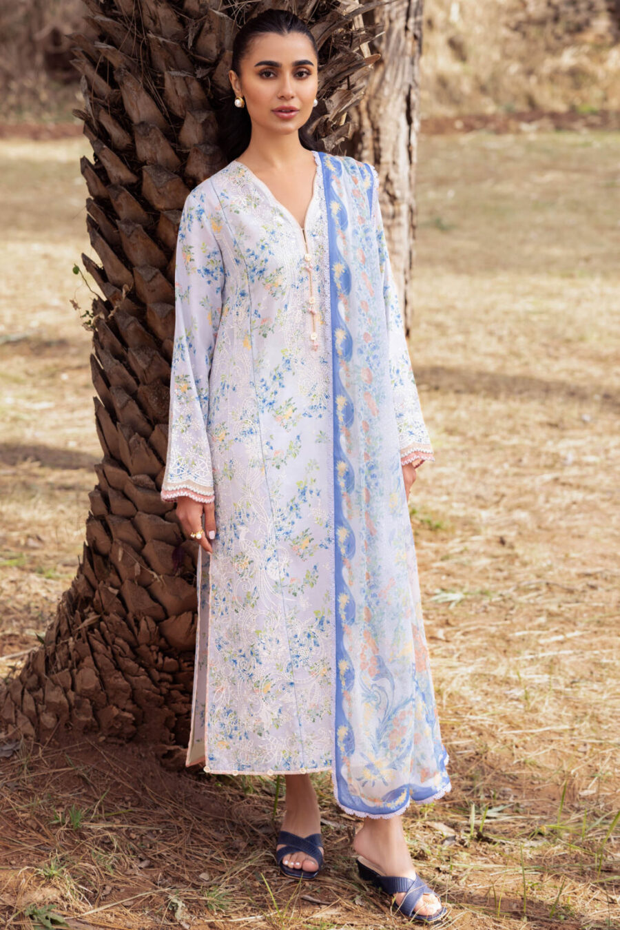 Stylish Lahore suits online featuring unstitched digital printed and embroidered lawn, chiffon duppata, and dyed cambric trousers for a complete outfit.