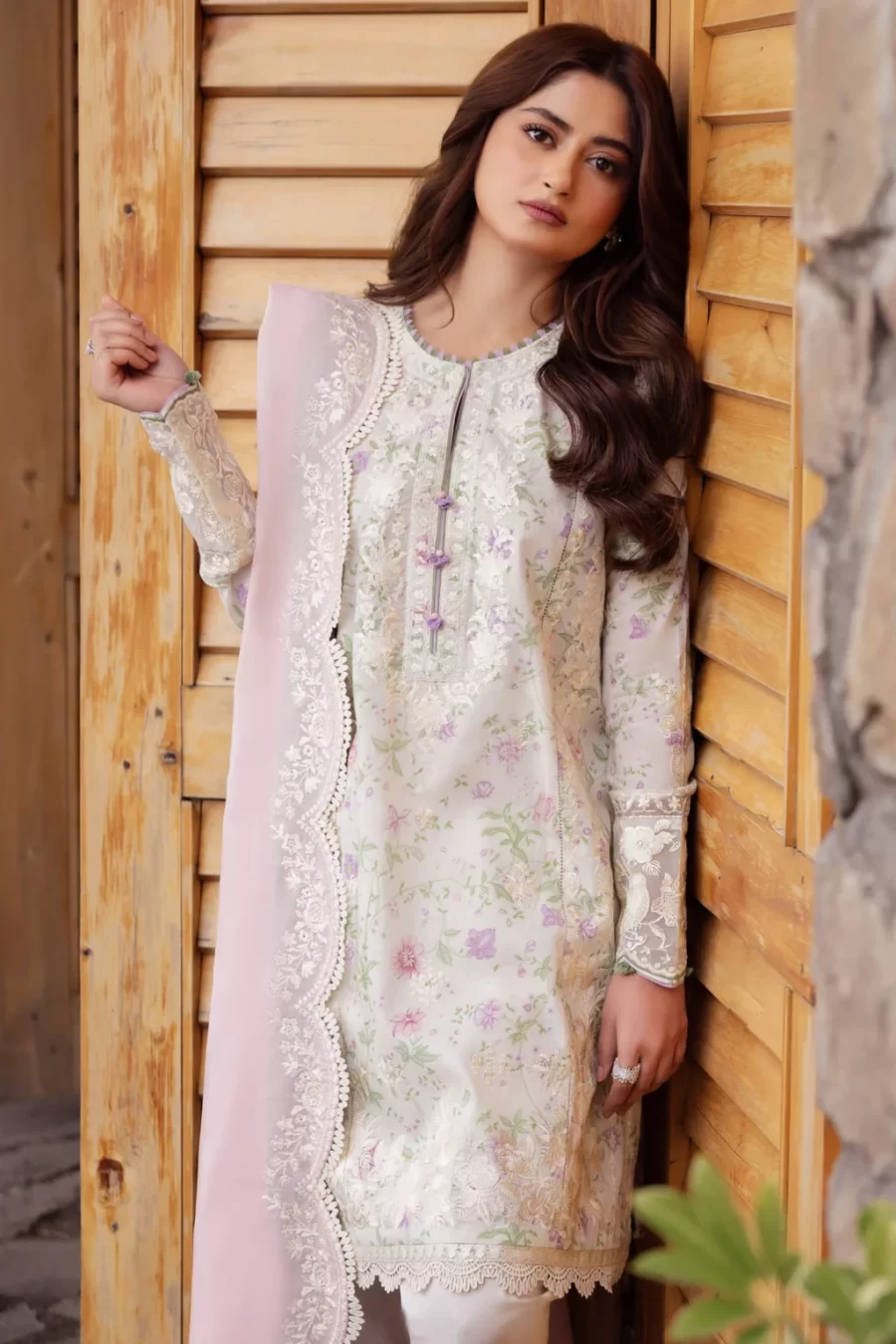 Explore stylish Pakistani unstitched lawn suits featuring embroidered digital print on lawn, organza hem borders, voile duppata, and dyed cambric trousers with free shipping and cash on delivery.