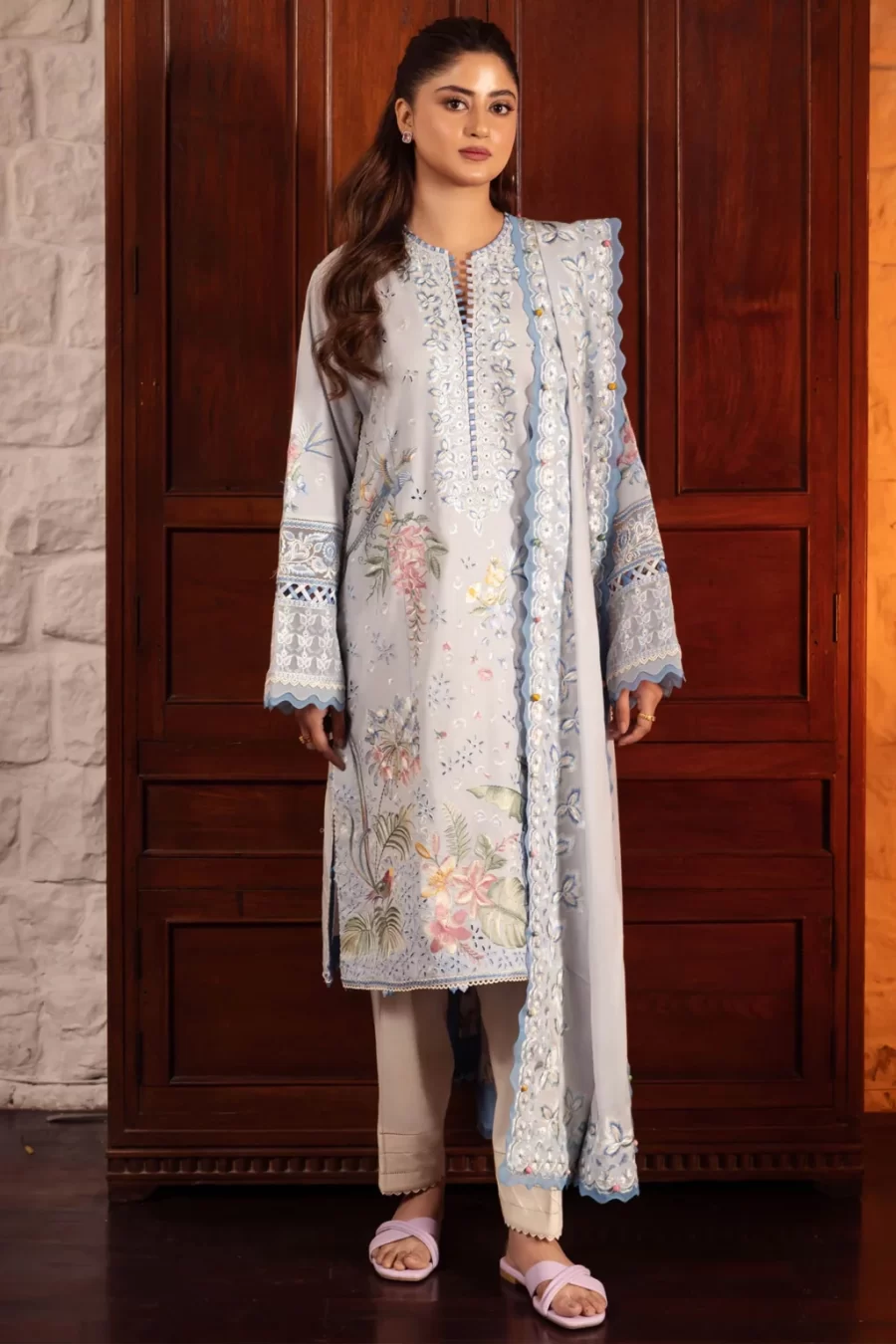 Traditional Karachi Pakistani suits includes unstitched embroidered front panels, sleeves, and hem borders. The voile duppata and cambric trouser complete the look.