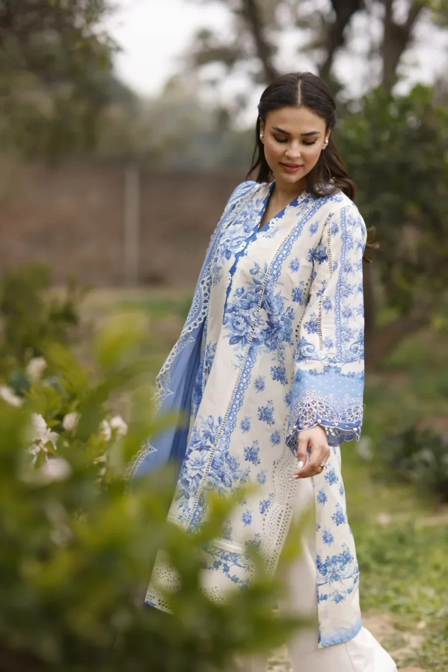 Discover elegant Pakistani suits for women. 100% original unstitched dress with embroidered lawn, chiffon dupatta, and cambric trousers. Buy online now!