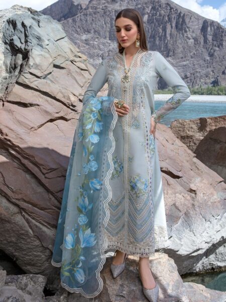 Discover Fabcollection's ice blue unstitched Pakistani suits with intricate embroidery, laser appliqued daman extensions, and a color blocked floral dupatta.