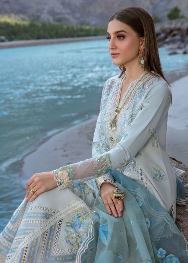 Premium ice blue unstitched Pakistani suits at Fabcollection. Features embroidered center and side panels, daman borders, and a hand-printed floral dupatta.