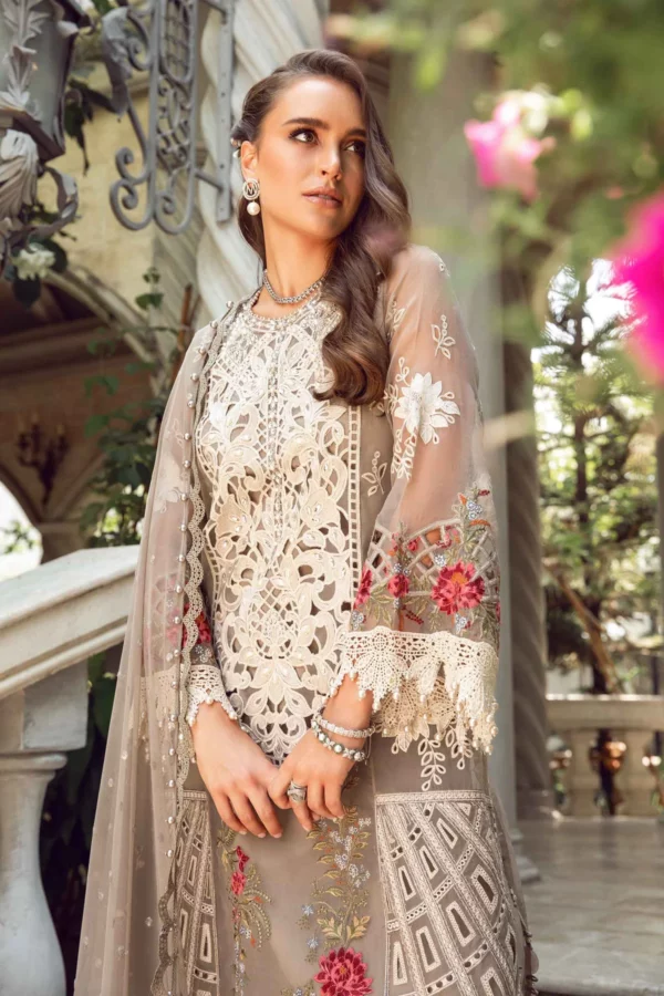 Experience luxury with Fabcollections' mouse grey unstitched Pakistani suit, including embroidered organza panels, sleeves, and a net dupatta.