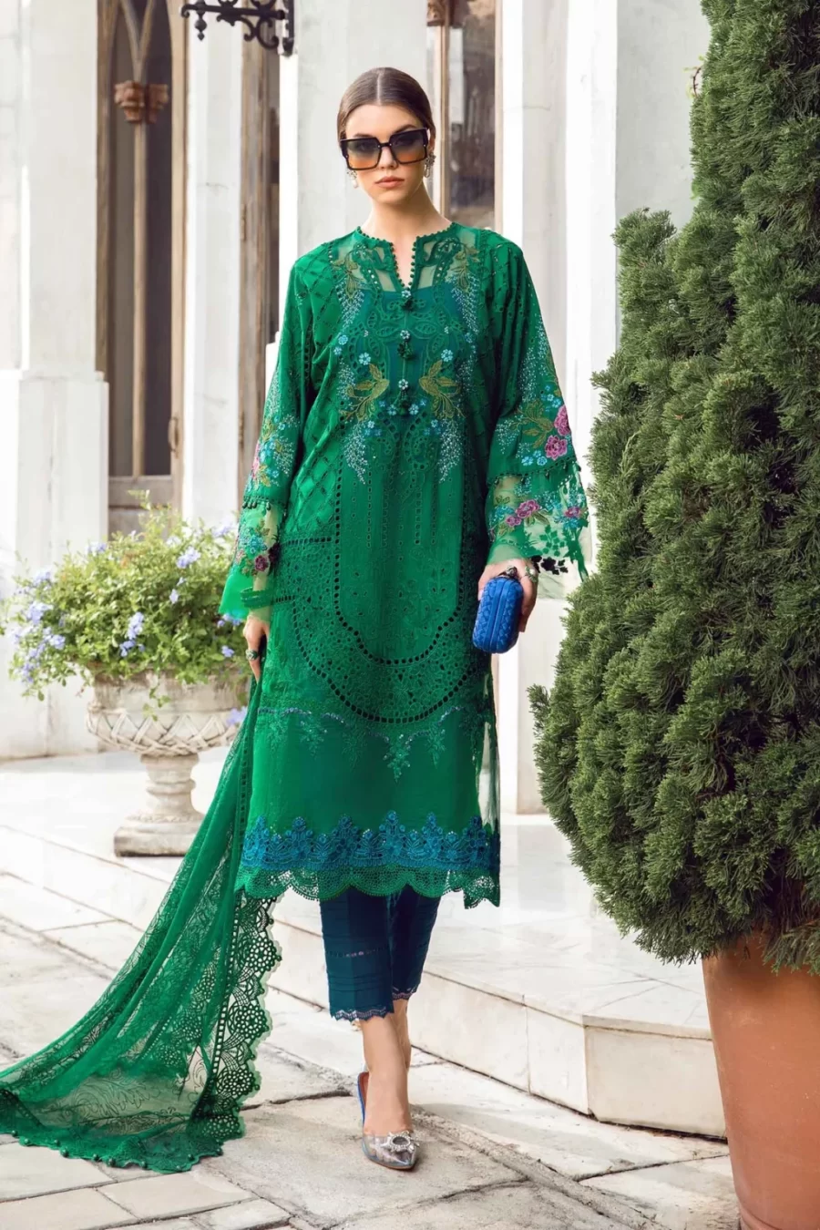 Discover Fabcollections' green unstitched Pakistani suit with embroidered lawn side panels, organza ghera patches, and cambric trousers.