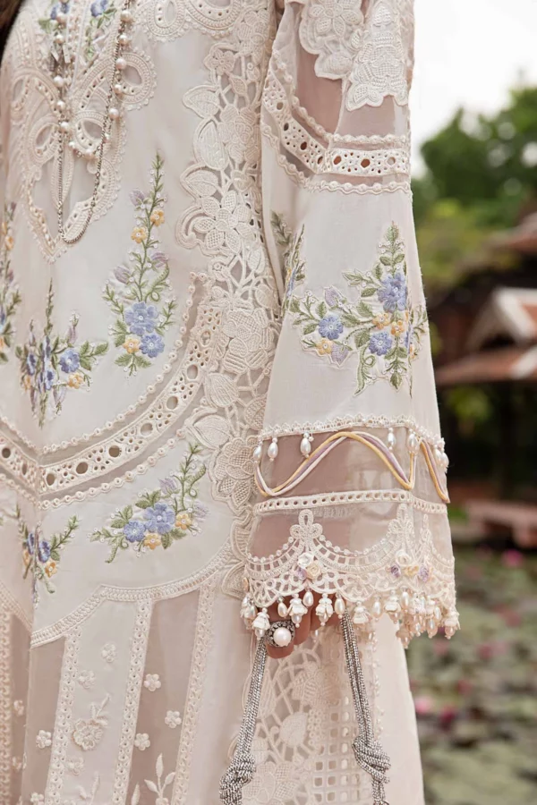 Explore Fabcollections' off white unstitched Pakistani suit online, featuring embroidered organza ghera patti, lawn front panel with 3D flowers, and a burnout organza dupatta.