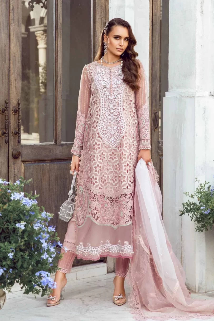 Discover Fabcollections' pink unstitched Pakistani suit with embroidered organza neck patch, 3D flowers, and a printed organza dupatta.