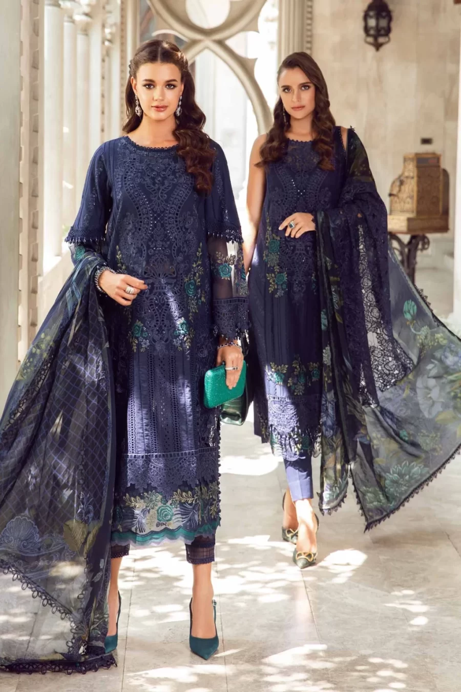 Discover Fabcollections' unstitched Pakistani suits featuring embroidered organza neck patch, 3D floral side panel, and printed silk dupatta in navy blue.