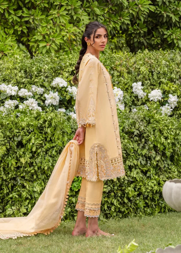 Explore Fabcollection's butter yellow unstitched Pakistani suit for daily wear, featuring embroidered lawn panels and khaddi net dupatta.